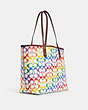 COACH®,REVERSIBLE CITY TOTE IN RAINBOW SIGNATURE CANVAS,pvc,Large,Gold/Chalk Multi,Angle View
