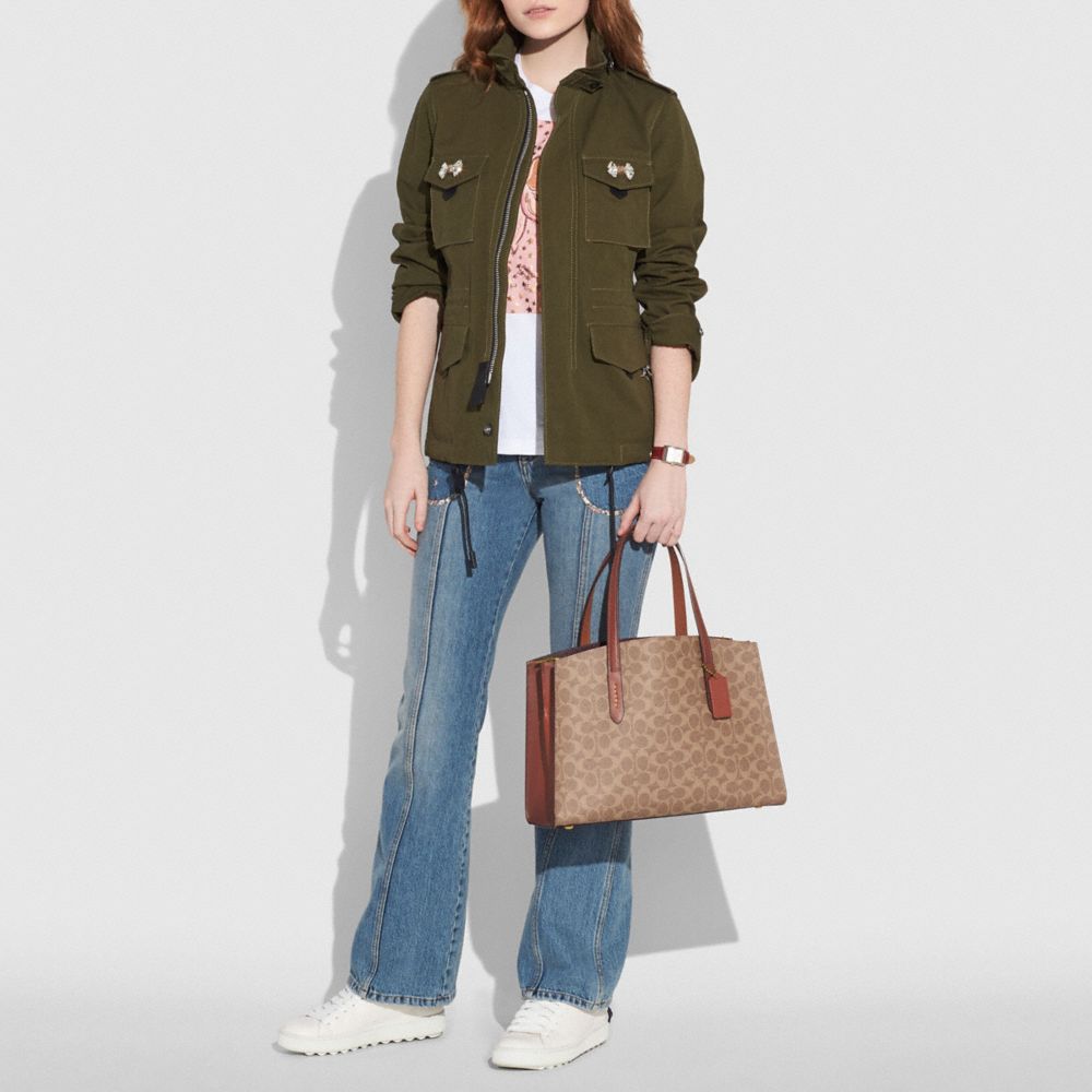 COACH® | Charlie Carryall In Signature Canvas