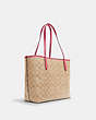COACH®,CITY TOTE IN SIGNATURE CANVAS,pvc,Large,Everyday,Gold/Light Khaki/Confetti Pink,Angle View