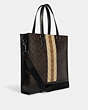 COACH®,GRAHAM STRUCTURED TOTE IN BLOCKED SIGNATURE CANVAS WITH VARSITY STRIPE,Leather,Large,Gunmetal/Mahogany Multi,Angle View