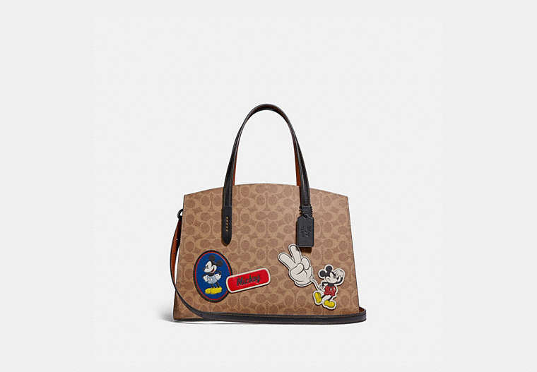 Disney X Coach Charlie Carryall In Signature Canvas With Patches
