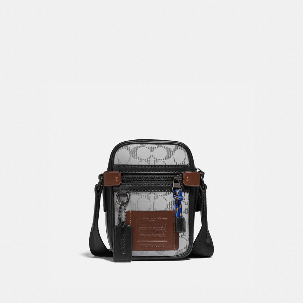 COACH® | Dylan 10 In Reflective Signature Canvas