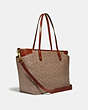 COACH®,BABY BAG IN SIGNATURE CANVAS,Signature Coated Canvas/Smooth Leather,X-Large,Brass/Tan/Rust,Angle View