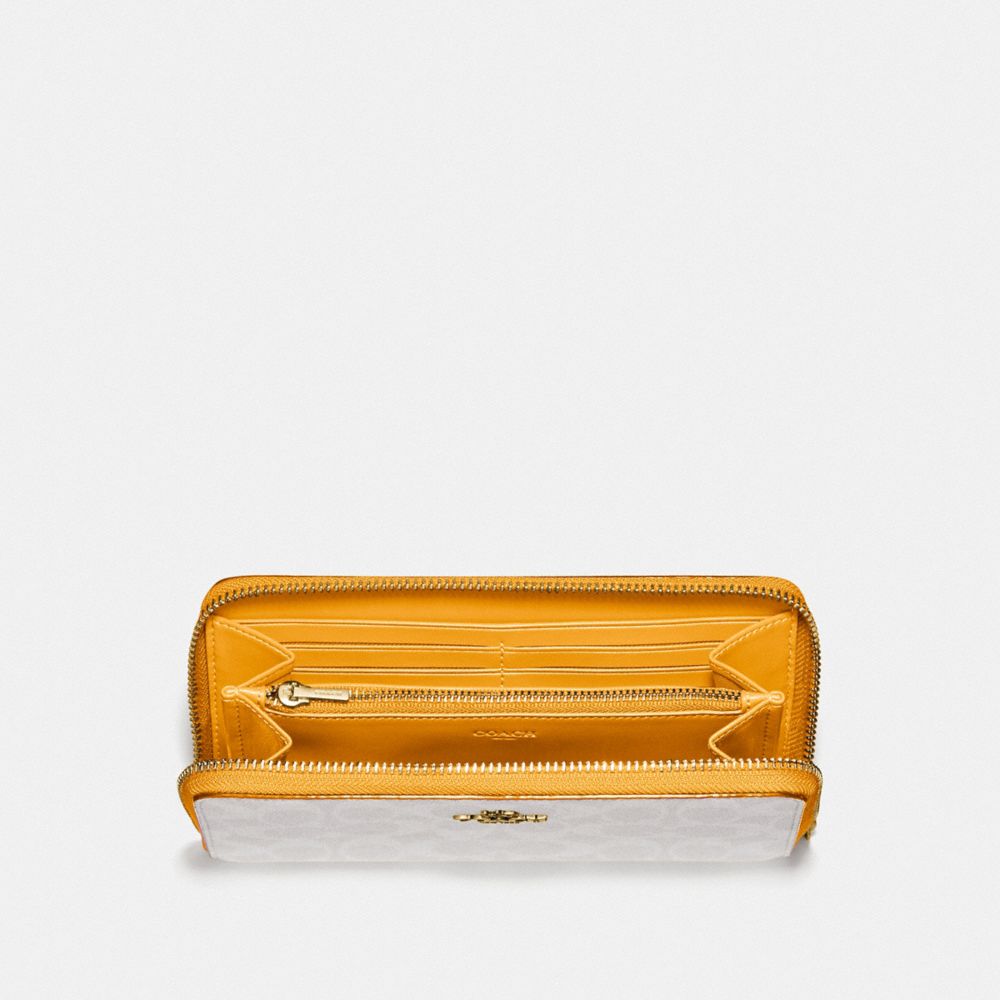 COACH Accordion Zip Wallet in Yellow