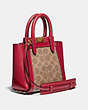 COACH®,TROUPE TOTE 16 IN SIGNATURE CANVAS,Coated Canvas,Small,Brass/Tan Red Apple,Angle View