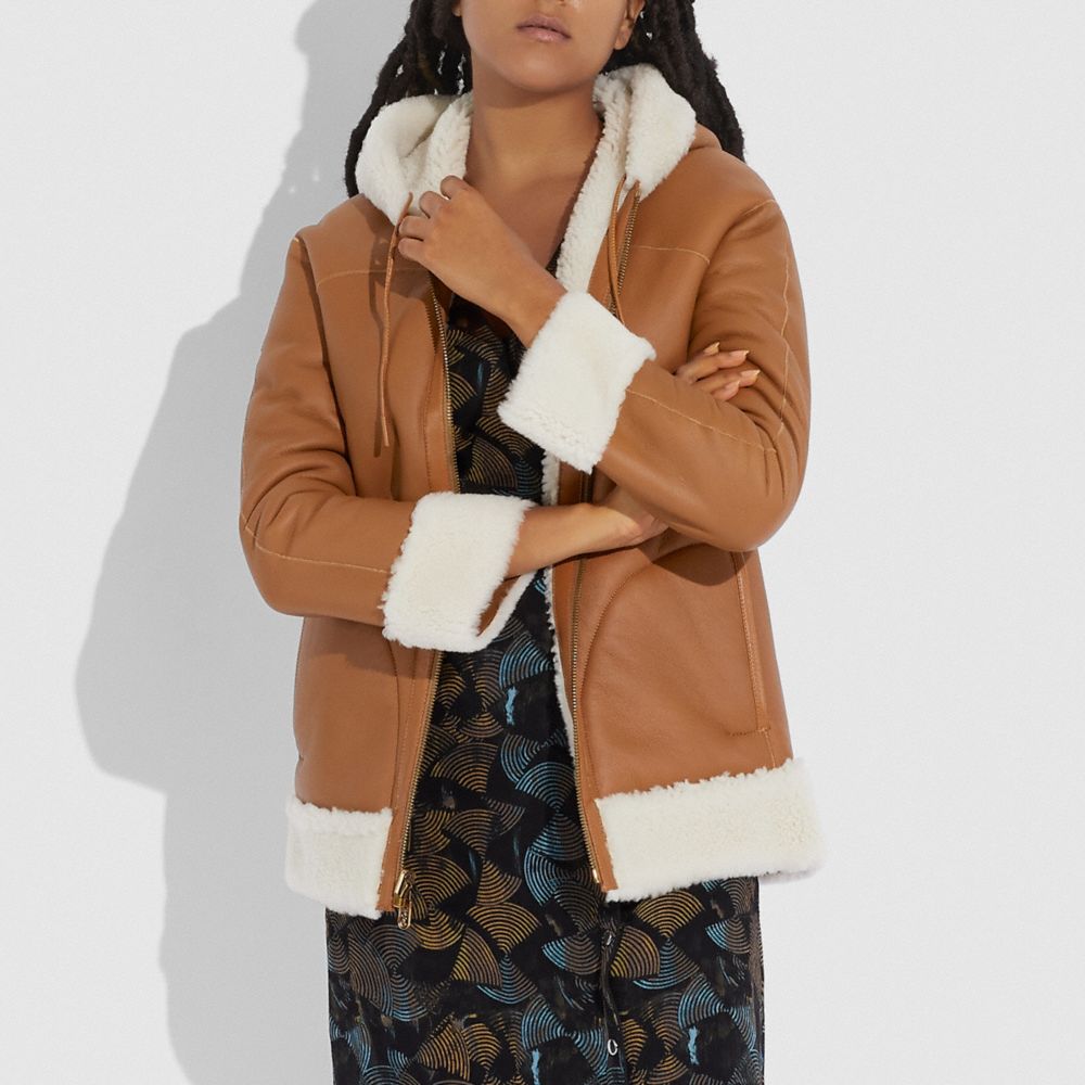 COACH®: Reversible Shearling Hoodie