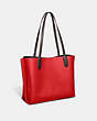 COACH®,WILLOW TOTE IN COLORBLOCK,Pebble Leather,Large,Brass/Sport Red Multi,Angle View
