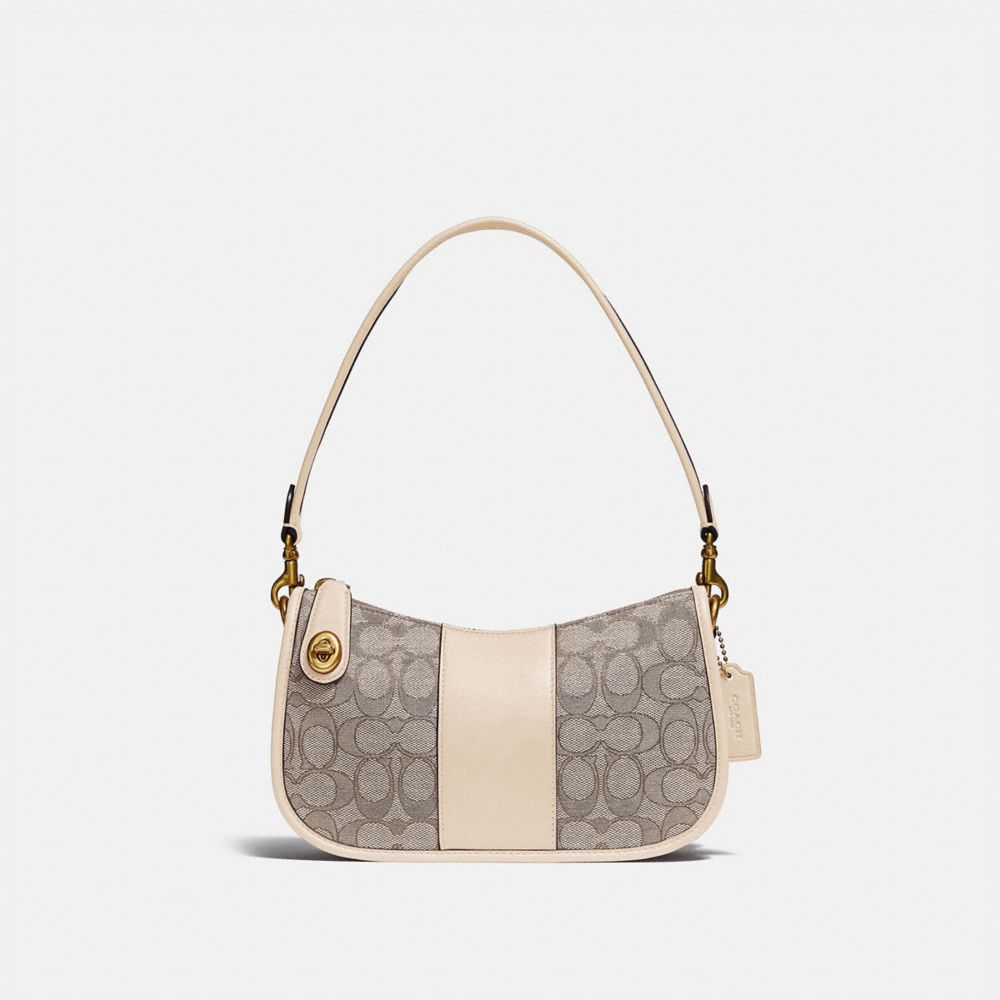 Arriba 95+ imagen signature jacquard coach