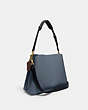 COACH®,WILLOW SHOULDER BAG IN COLORBLOCK,Pebble Leather,Large,Brass/Denim,Angle View