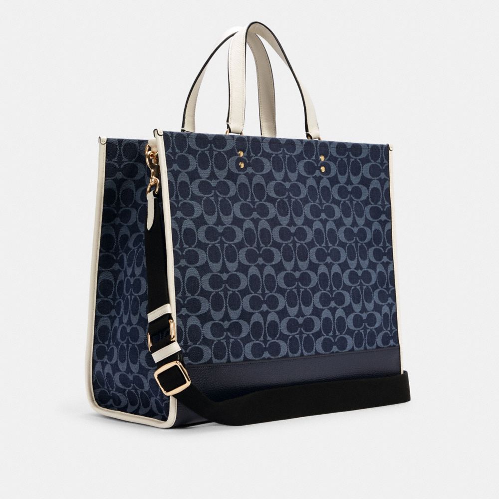COACH®,Dempsey Tote Bag 40 In Signature Denim With Coach Patch,,Angle View