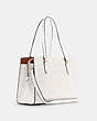 COACH®,TATUM CARRYALL IN SIGNATURE CANVAS,Signature Coated Canvas/Smooth Leather,Large,Gold/Chalk/Glacierwhite,Angle View