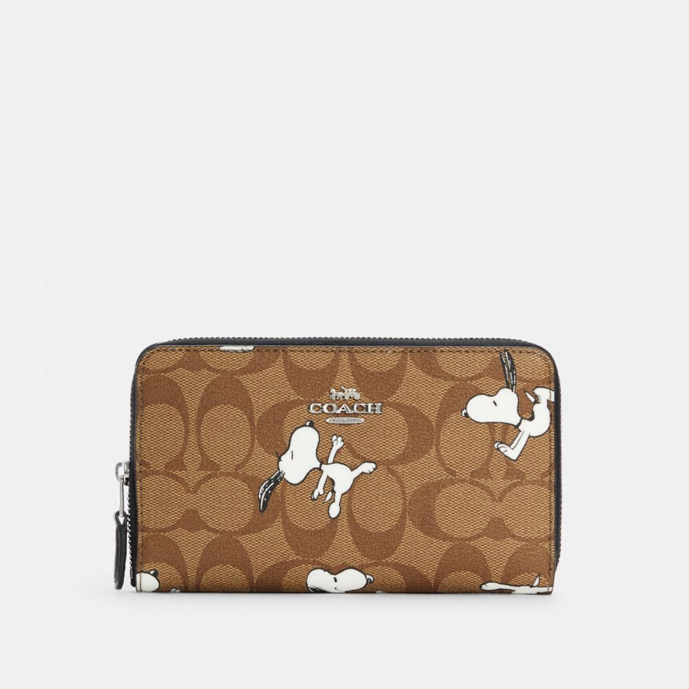 COACH® Outlet Coach X Peanuts Medium Id Zip Wallet In Signature Canvas With Snoopy Print