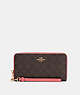 COACH®,LONG ZIP AROUND WALLET IN SIGNATURE CANVAS,pvc,Mini,Gold/Pink Lemonade,Front View