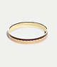 COACH®,SIGNATURE BANGLE,Enamel/Plated Brass,Gold/ Pink Multicolor,Front View