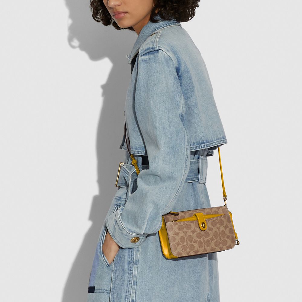 COACH® | Noa Pop Up Messenger In Signature Canvas