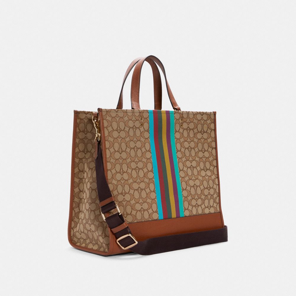 COACH®,Dempsey Tote Bag 40 In Signature Jacquard With Stripe And Coach Patch,,Angle View