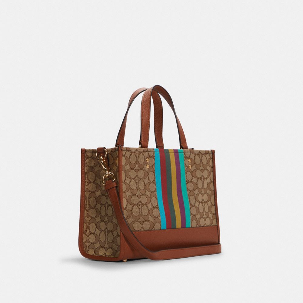 COACH®,Dempsey Carryall Bag In Signature Jacquard With Stripe And Coach Patch,,Angle View