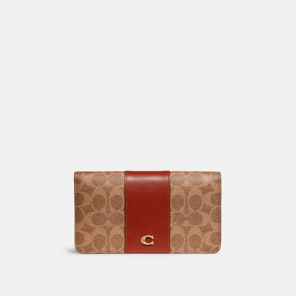 boxed mini wallet on a chain in signature canvas