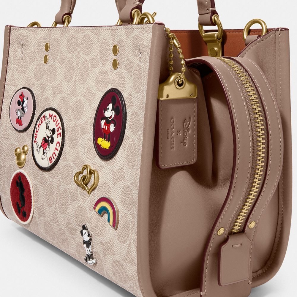 COACH® | Disney X Coach Rogue 25 In Signature Canvas With