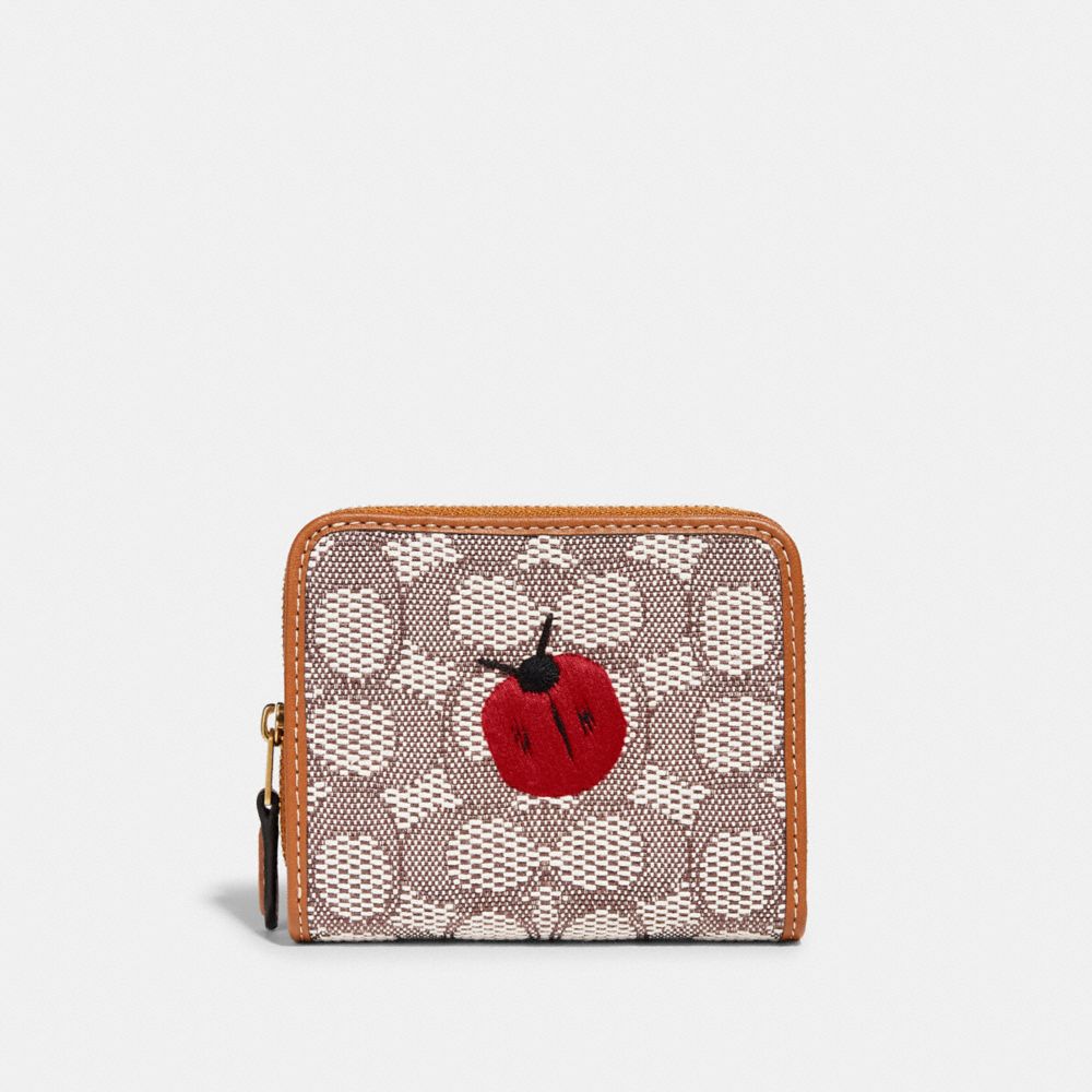 COACH® | Billfold Wallet In Signature Textile Jacquard With Ladybug Motif  Embroidery