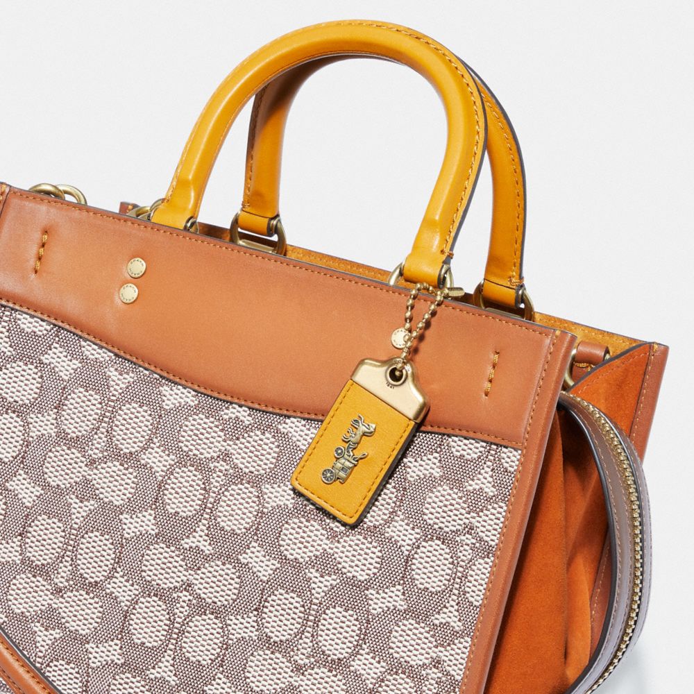 COACH®: Rogue 25 In Signature Textile Jacquard