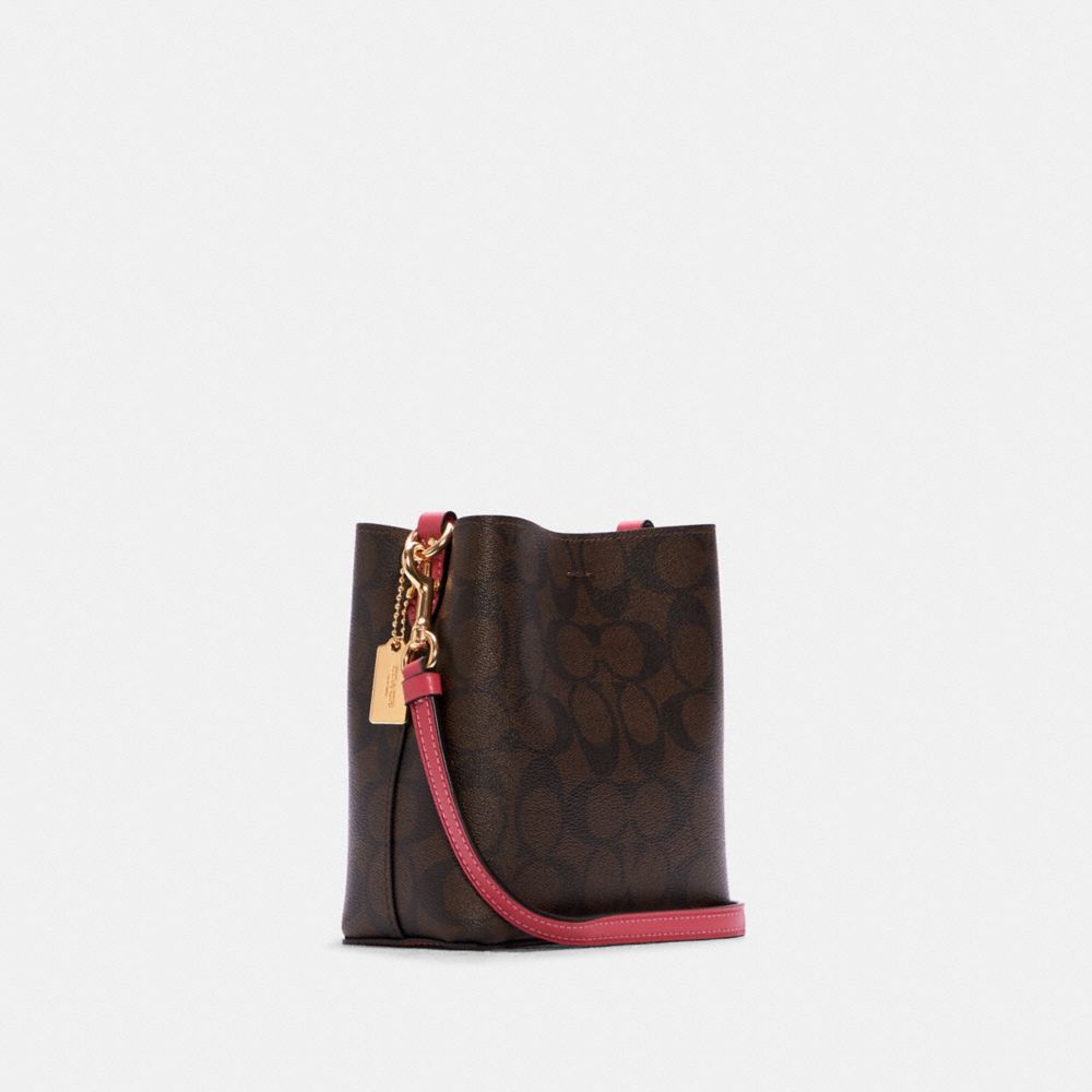 COACH®,Mini Town Bucket Bag In Signature Canvas,,Angle View