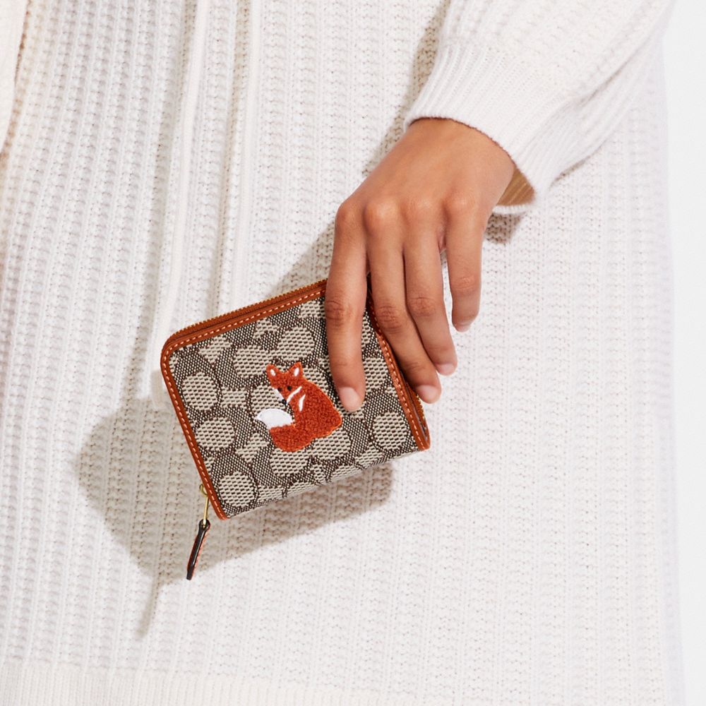 COACH® | Billfold Wallet In Signature Textile Jacquard With Fox Motif