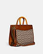 COACH®,ROGUE IN SIGNATURE TEXTILE JACQUARD,Jacquard,Large,Brass/Cocoa Burnished Amb,Angle View