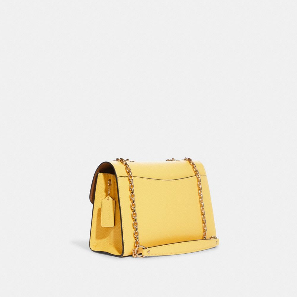 No Boundaries yellow patent crossbody bag. munimoro.gob.pe