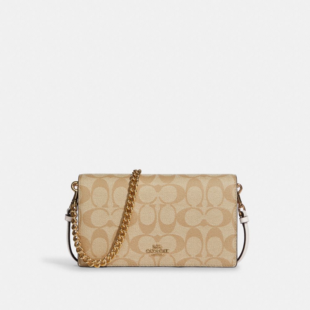 COACH® Pochette portécroisé pliable Anna avec chaîne en toile signature