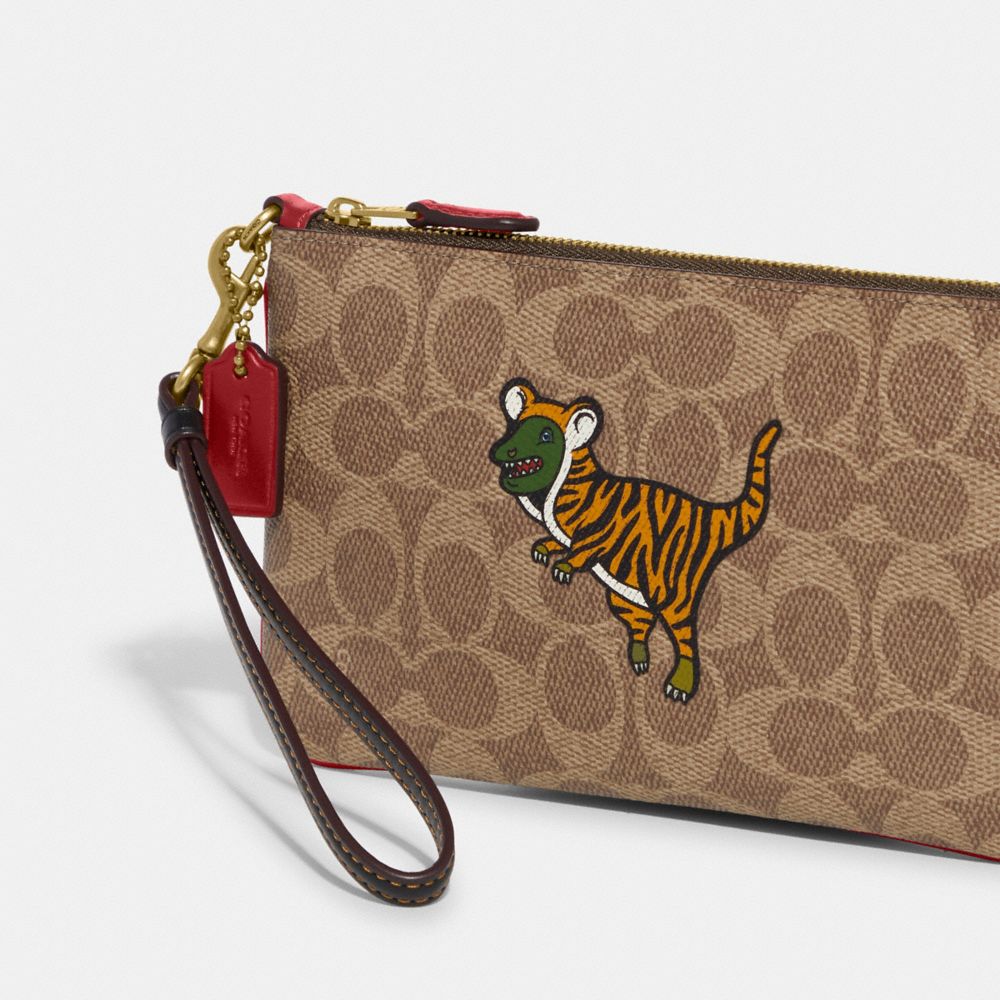 COACH® Lunar New Year Small Wristlet In Signature Canvas With Tiger Rexy