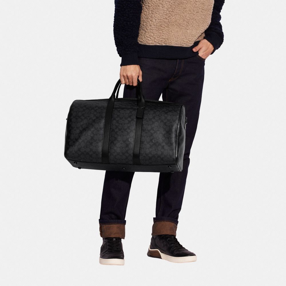 Coach Gotham Duffle In Signature Canvas In Black Copper/charcoal