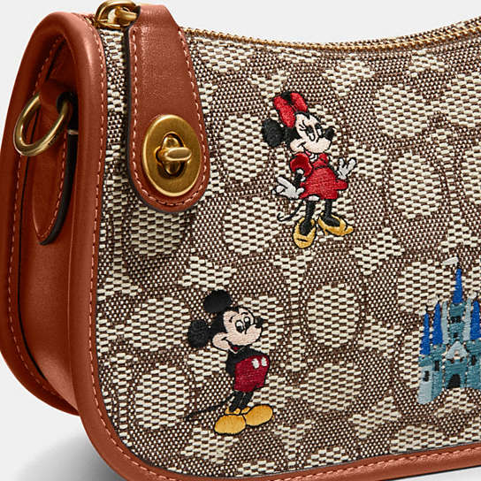 COACH® | Disney X Coach Swinger Bag In Signature Textile Jacquard With  Mickey Mouse And Friends Embroidery