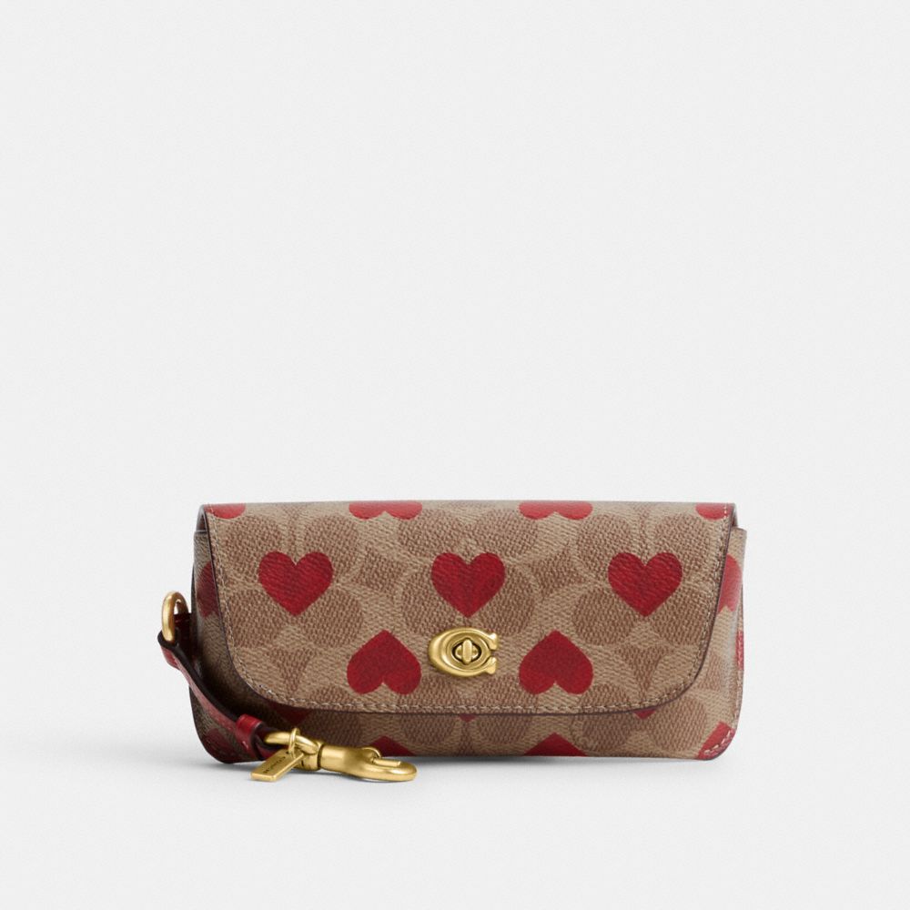 COACH® Sunglass Case Bag Charm In Signature Canvas With Heart Print