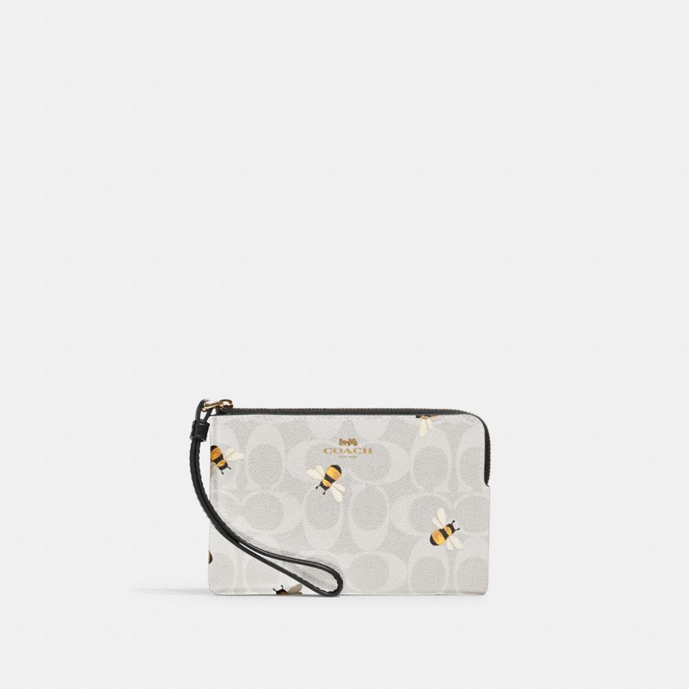 COACH OUTLET® | Corner Zip Wristlet In Signature Canvas With Bee Print