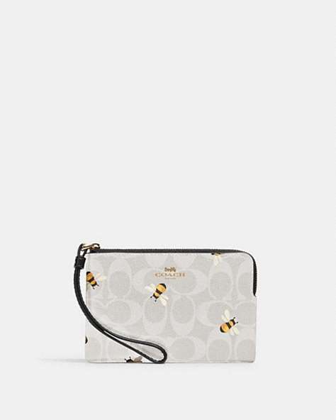 COACH®,CORNER ZIP WRISTLET IN SIGNATURE CANVAS WITH BEE PRINT,Coated Canvas/Leather,Gold/Chalk/Glacier White Multi,Front View