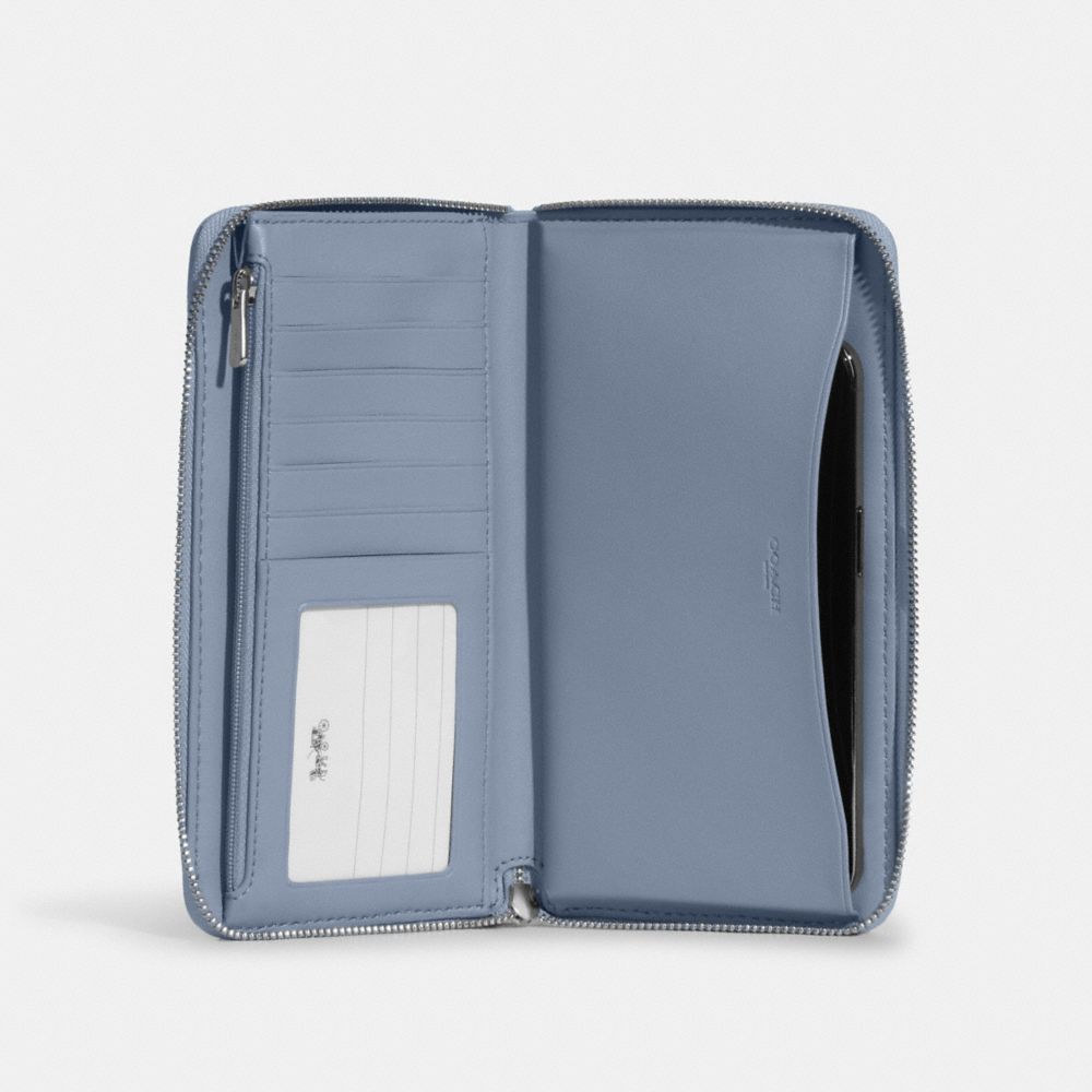 Dempsey Large Phone Wallet In Signature Jacquard With Stripe And Coach Patch
