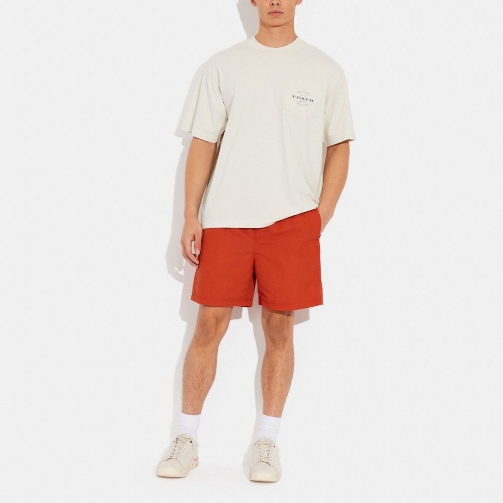 COACH®,MAGIC PRINT SIGNATURE SWIM TRUNKS,Polyester,Deep Orange,Scale View