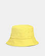 COACH®,REVERSIBLE SIGNATURE NYLON BUCKET HAT,Polyester,Yellow,Angle View