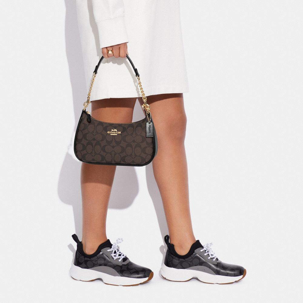 teri shoulder bag in signature canvas