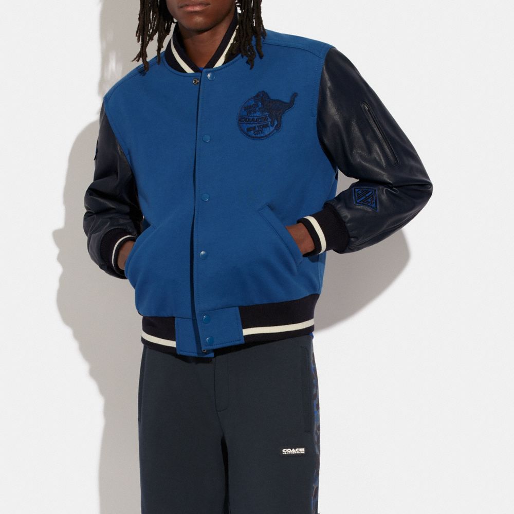 blue varsity jacket with hood