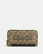 COACH®,LONG ZIP AROUND WALLET IN SIGNATURE CANVAS WITH VARSITY MOTIF,Signature Coated Canvas,Mini,Gold/Khaki/Amazon Green,Front View