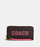 COACH®,LONG ZIP AROUND WALLET IN SIGNATURE CANVAS WITH VARSITY MOTIF,Signature Coated Canvas,Mini,Im/Brown/Watermelon,Front View