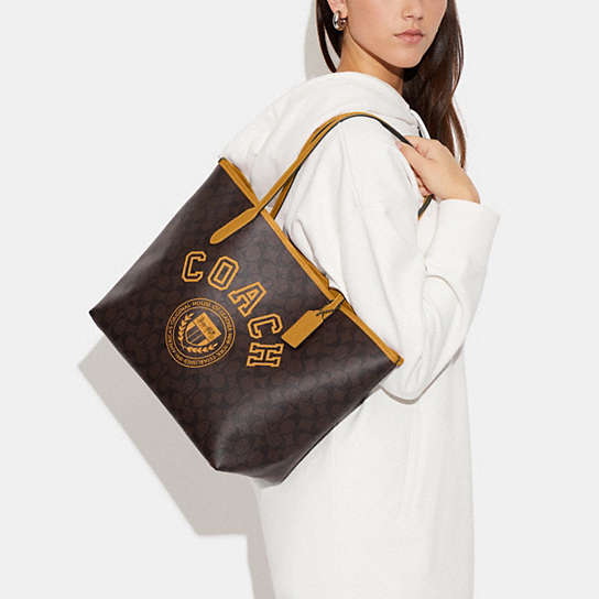 COACH®  City Tote In Signature Canvas With Varsity Motif