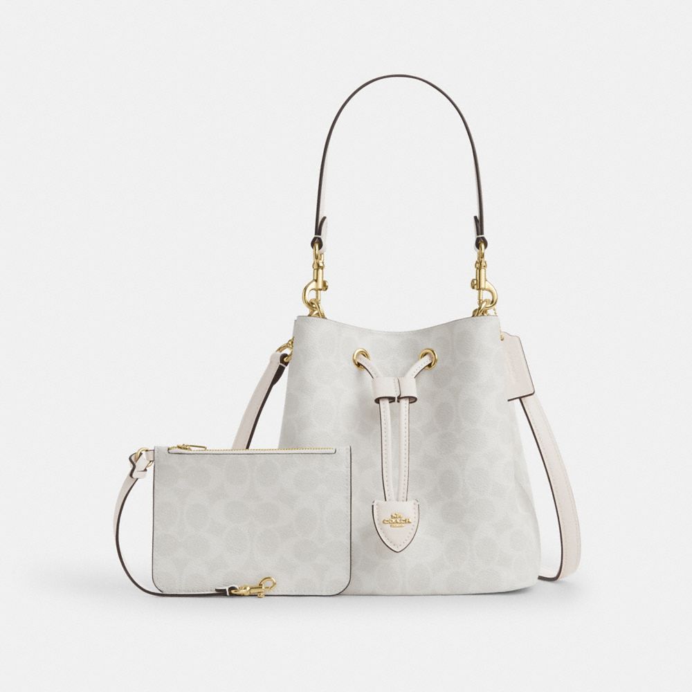 COACH®,Rowan Bucket Bag In Signature Canvas,Canvas,Leather,Bucket,Metal,Casual,Gray,Angle View