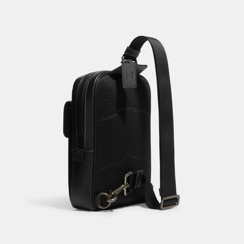 COACH®,Disney X Coach Track Pack In Signature Canvas With Patches,,Angle View