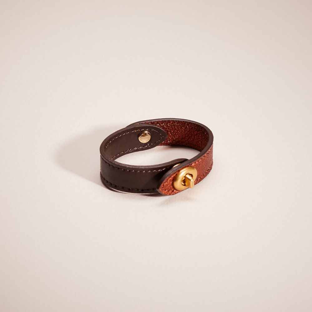 Coach Remade Turnlock Bracelet In Mahogany Brown