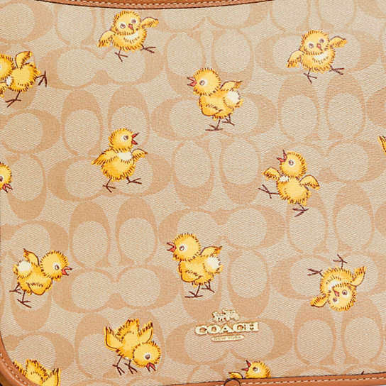 COACH® | Dempsey File Bag In Signature Canvas With Tossed Chick Print