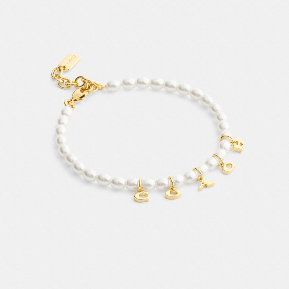 COACH®,Coach Charms Pearl Bracelet,Pearl,Cubic Zirconia,Metal Material,Glass,Pearl,Gem Embellishment,Lettering Word,Logo,R...,White,Front View