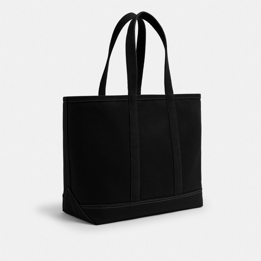 COACH®,Utility Tote,Leather,Cotton,Canvas,Tote,Logo,Word Embellishment,Sustainable,Casual,Black,Angle View